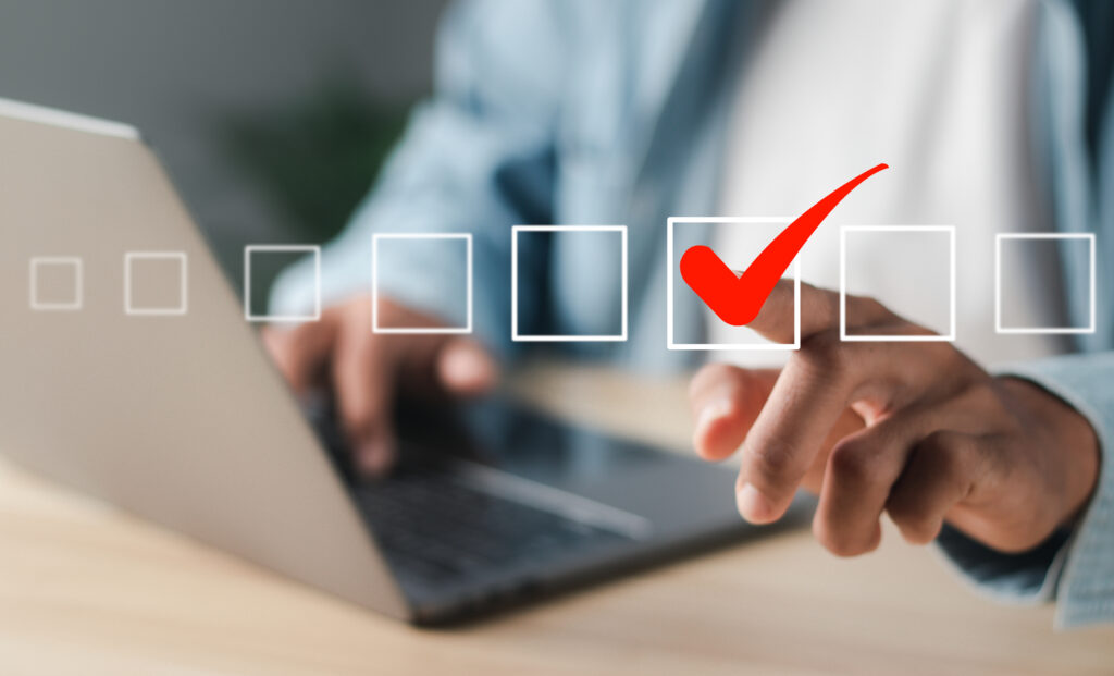 A businessman is touching a square box with the correct icon on a virtual interface, much like Choosing the Right Fixtures for Indoor & Outdoor Lighting Installation